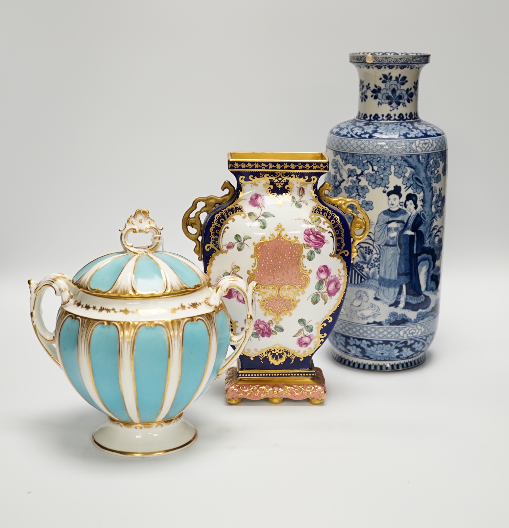 Eight porcelain items; a late 18th century Derby plate with painted scene of Coniston Lake, Lancashire, two floral painted Paris porcelain plates, a pair of Booths blue and white vases, a lidded vase, a Copeland blue gro